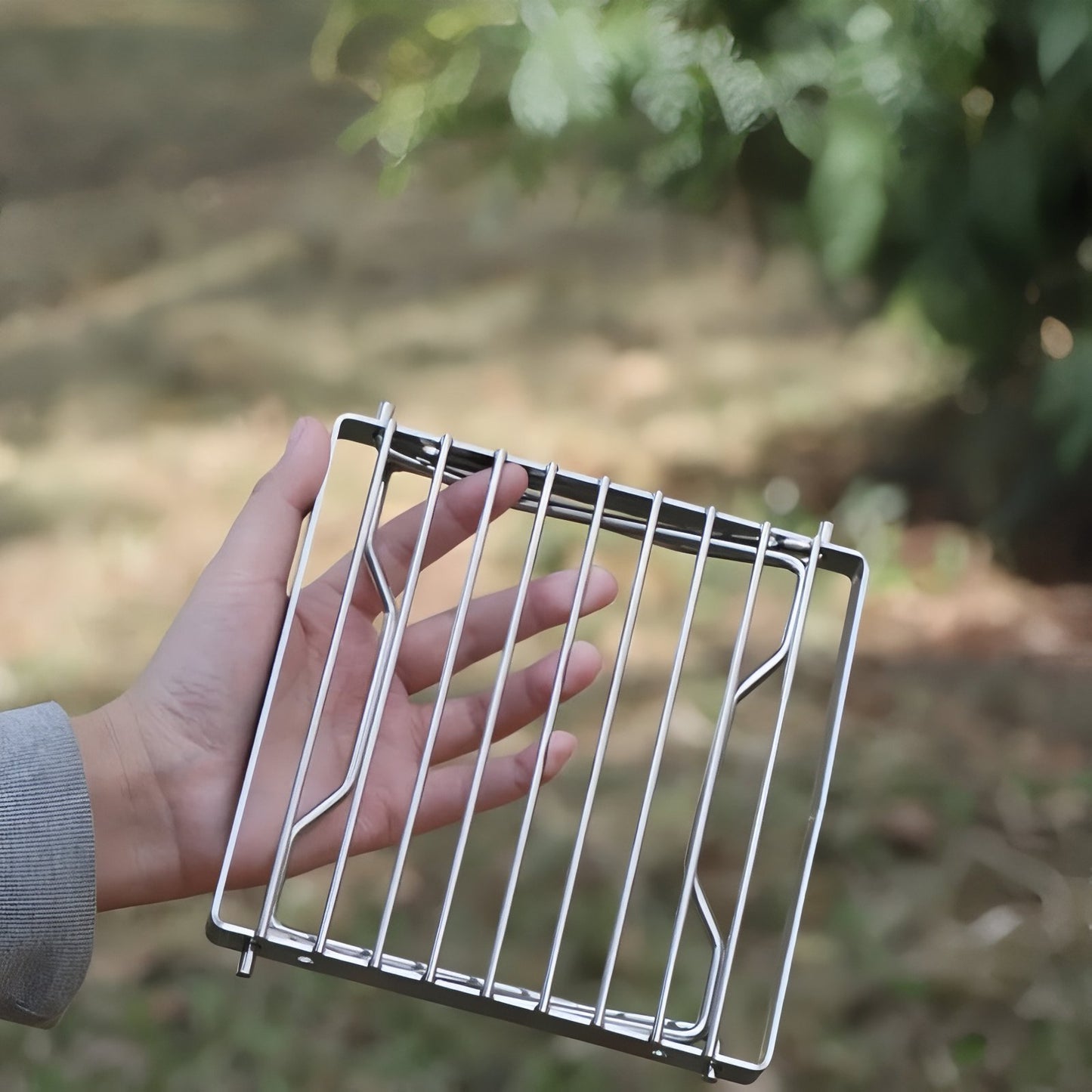 Grille De Cuisson Pour Réchaud À Gaz portée à la main