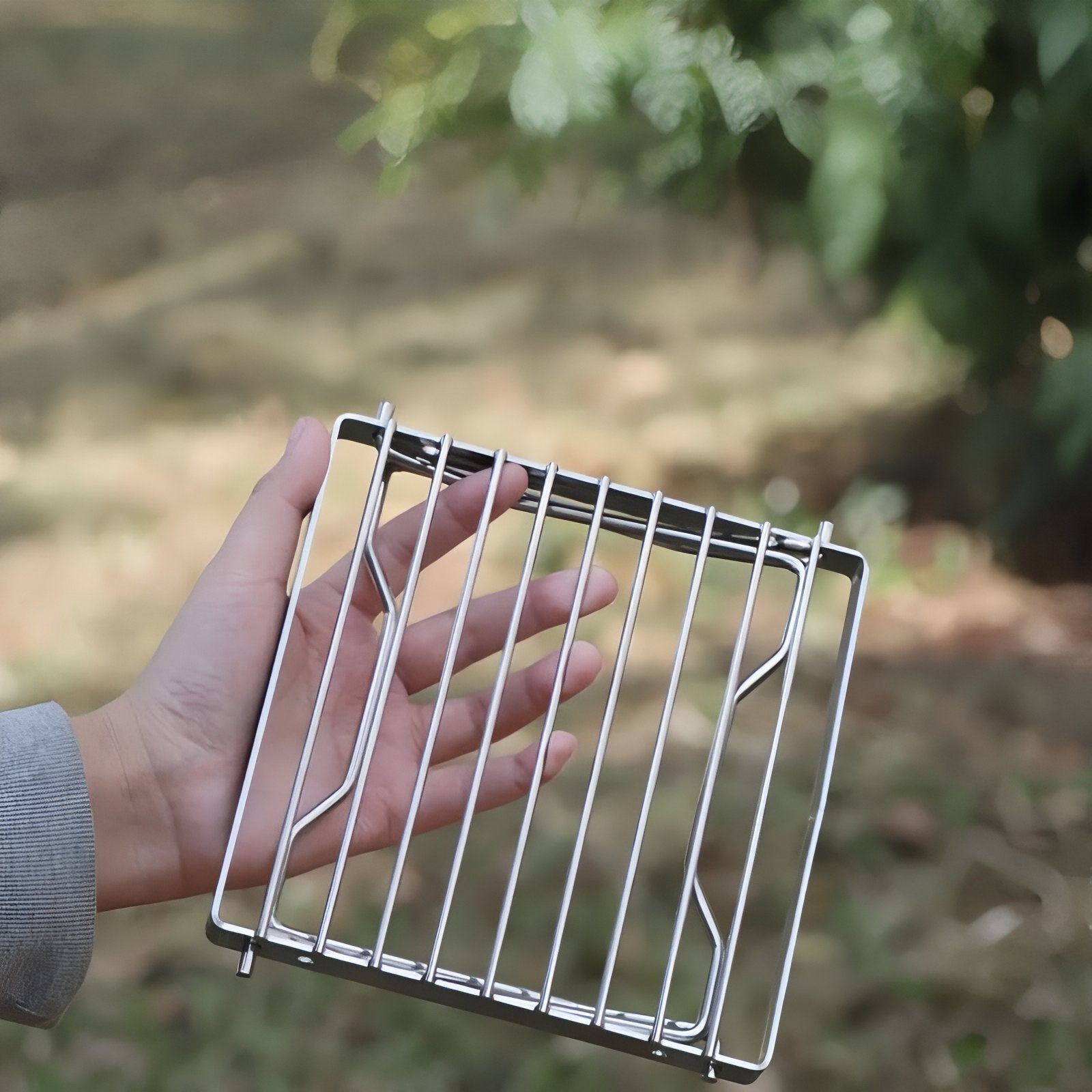 Grille De Cuisson Pour Réchaud À Gaz portée à la main